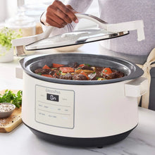 GreenPan slow cooker with open lid, showing food inside the ceramic insert.
