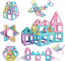 Magnetic building blocks set with multicolor star and house pieces arranged on white