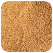Ground kombucha powder, light brown granular texture