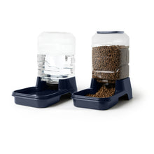 Navy gravity pet waterer with clear bottle and base with second clear container