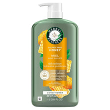 Green hair conditioner bottle with white pump and Honey Daily Moisture front label