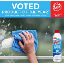 Windex foam glass cleaner bottle with spray foam on window and blue cloth