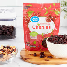 Sweetened dried cherries pouch with bowls of dried cherries on a table