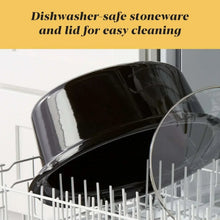 Black slow cooker lid and stoneware insert placed on a dishwasher rack
