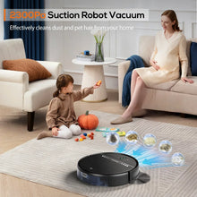 Black robot vacuum on a living room rug next to a sofa and person
