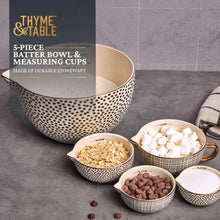 Ceramic mixing bowl with black dot pattern and four nested measuring bowls