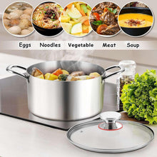Stainless steel stock pot with glass lid and side handles, filled with mixed food