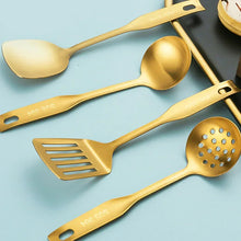 Golden wok utensil set with slotted spatula, skimmer, and perforated spoon.
