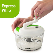 Two-speed chop and whip food processor with green lid, held by hands over bowl