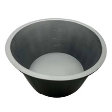 Black silicone slow cooker liner, round bowl shape with measurement marks