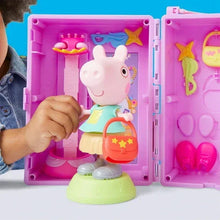 Purple dress-up wardrobe playset with small doll on base, open case and purse accessory