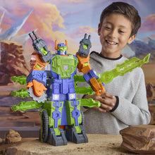 Transforming robot action figure with green and blue armor, held by a child