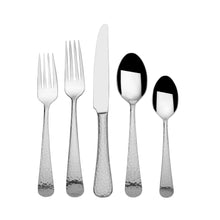 Stainless steel flatware with hammered handles, including forks, knife, and spoons