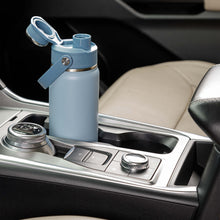Light blue chug water bottle with flip lid, strap handle, and stainless base