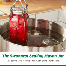 Wide-mouth mason jar lids and bands on glass jars