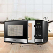 Black stainless microwave oven with open door and side dimension labels
