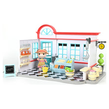 General store dollhouse playset with open doors, shelves, and doll figure