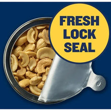 Jar opening with cashews and “FRESH LOCK SEAL” sticker on the metal rim