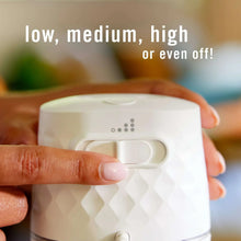 White Febreze Plug oil warmer with hand-held grip and side control switch