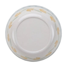Bamboo melamine salad bowl interior with light floral pattern and smooth white base.