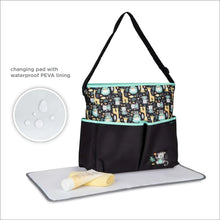 Monkey-print diaper tote with attached changing pad, waterproof PEVA lining, black and teal trim
