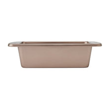 Rose-gold loaf pan with flat rim, shown from the side