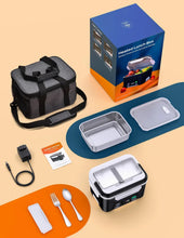 Heated lunch box with accessories laid out: strap, charging cable, utensils, and inner trays