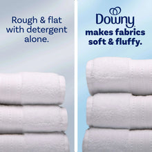 Fabric softener result: stacked white towels, smooth and fluffy texture