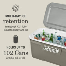 Coleman hard chest cooler with open lid, silver-gray body