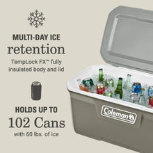 Coleman hard chest cooler with open lid and insulated interior holding bottles