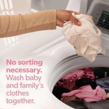 Dreft baby laundry detergent jug concept for washing clothes together in a washer.