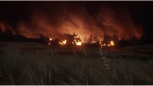 PlayStation 5 game screenshot: massive fires burning in a dark outdoor area