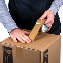 Tan packing tape being applied along a cardboard shipping box seam