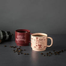 Stacking stoneware mugs: maroon “Hello gorgeous” mug with blush bow-pattern mug