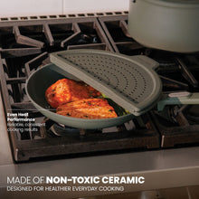 Moss green ceramic non-stick fry pan with vented lid insert on gas stove