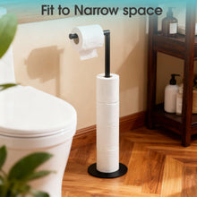 Free-standing black toilet paper holder stand with stacked spare rolls on the base