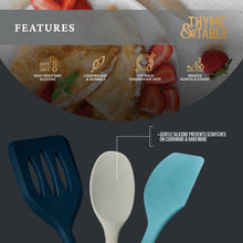 Three silicone mini kitchen utensils: dark blue slotted spatula, white spoon, light blue spoon