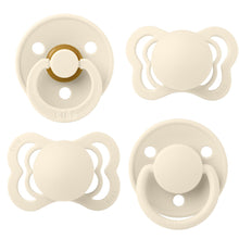 Four ivory BIBS pacifiers shown from the front, with round and symmetrical shields
