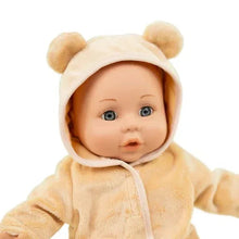 Baby doll with blue eyes wearing tan hooded sleeper with bear ear hood.