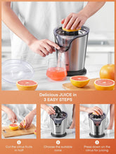 Stainless steel citrus juicer with clear cup under the cone, orange halves and juice
