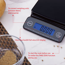 Black digital kitchen scale angled view with blue-lit LCD and UNIT/TARE buttons