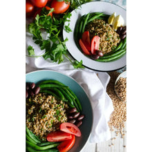 Farro grain salad bowl with green beans, tomatoes, and herbs