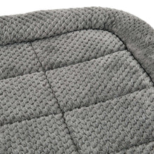 Gray padded crate mat pet bed with quilted diamond stitch pattern cushion.