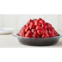 Clear glass pie plate filled with red berries