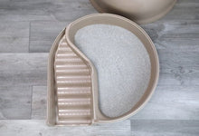 Enclosed cat litter box with dome hood, hinged lid open to litter tray