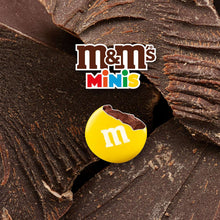 Milk chocolate candy egg with M mark nestled in chocolate pieces
