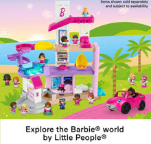 Barbie dreamhouse playset with multiple Little People figures and a pink car