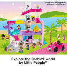 Multi-level dollhouse playset with accessories, pink car, and small character figures
