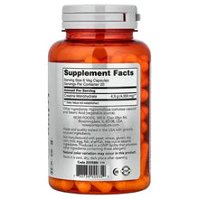 Creatine monohydrate supplement facts label on back of bottle with amber capsules
