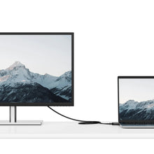 HDMI cable linking TV and laptop, black cable with HDMI ends
